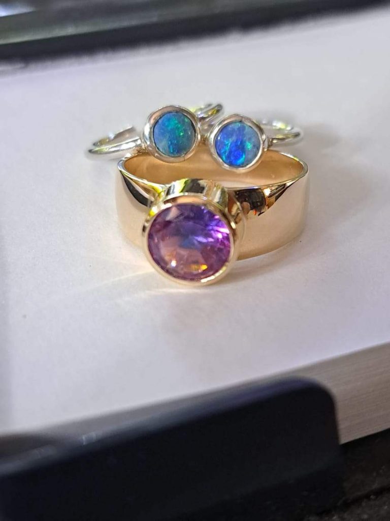 Three distinct pieces, each showcasing one of the original gemstones from the single multi-gem ring