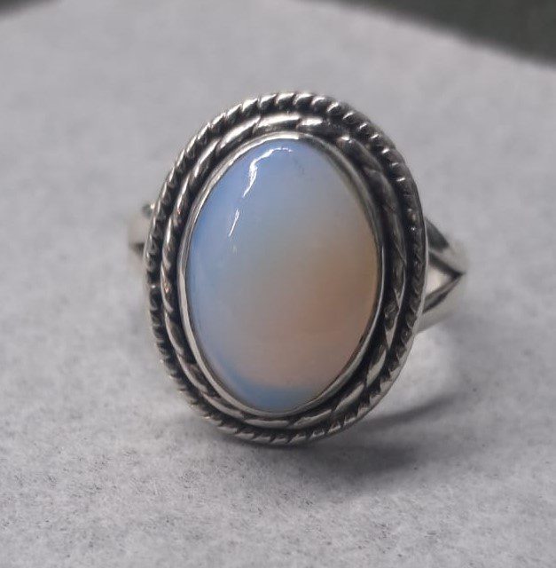 Restored ring with polished metal and replaced stone after expert repair by Jewel Art Consulting