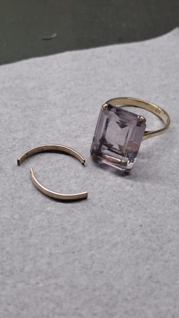 Fully repaired ring with a revitalized gemstone and polished finish after expert restoration